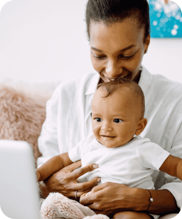 mother holding her child smiling