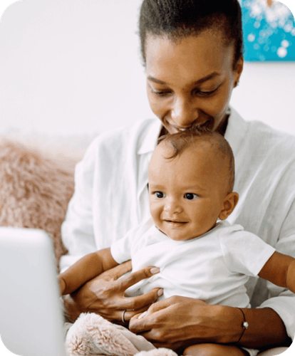 mother holding her child smiling
